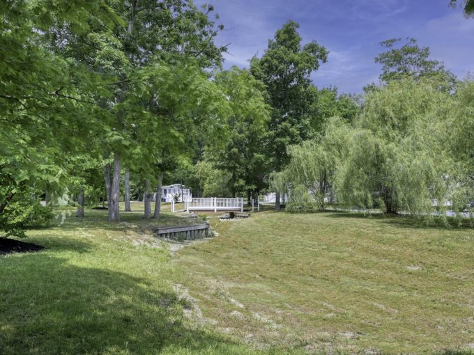 View of a small bridge and trees around it at Carol Lynn Resorts East