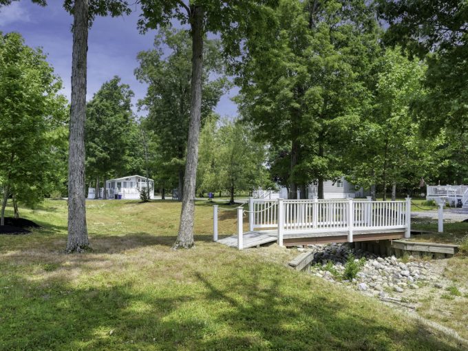 View of a small bridge and trees around it at Carol Lynn Resorts East